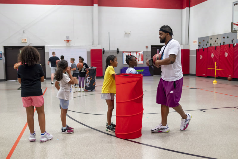 Coach O working with young athletes